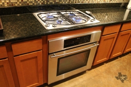 lone-star-luxury-homes-78704-kitchen-gas-cooking